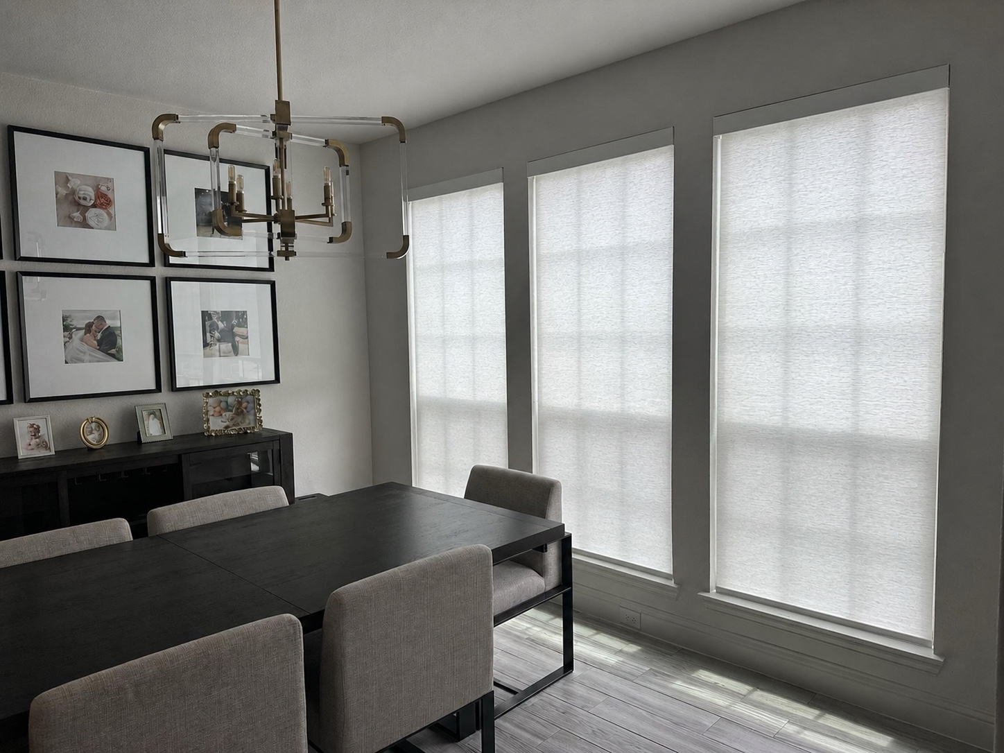 Dining room roller shades fully lowered for evening privacy