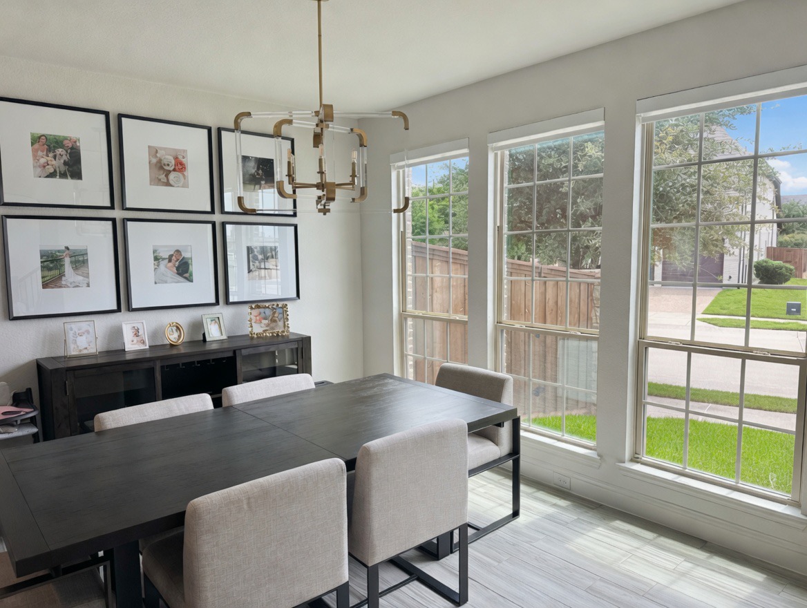 Dining room roller shades fully raised to welcome morning light